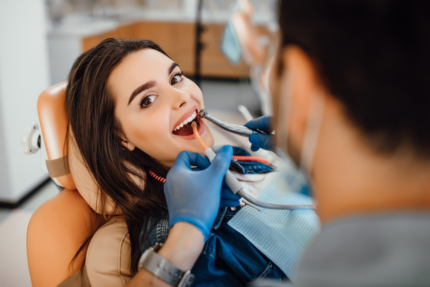 Young female patient visiting dentist office